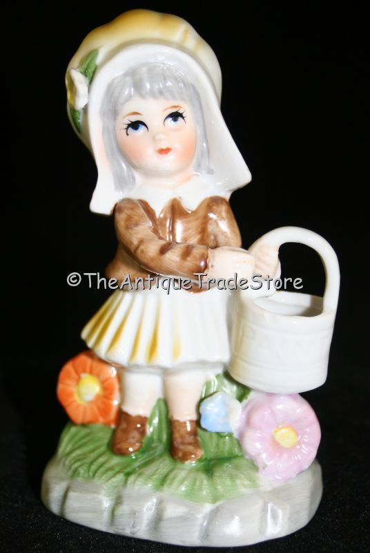 Vintage ceramic figurine Dutch style girl with paint bucket