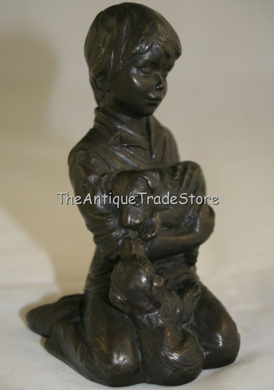 Vintage cast resin figurine Boy holding a Puppy