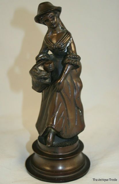 Vintage bronzed cast brass Lady with the basket figurine ornament