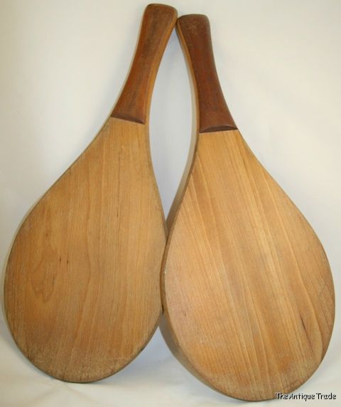 A pair of vintage solid wood Squash rackets
