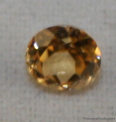 Natural Andradite yellow Garnet 4mm round 0.3ct ga10