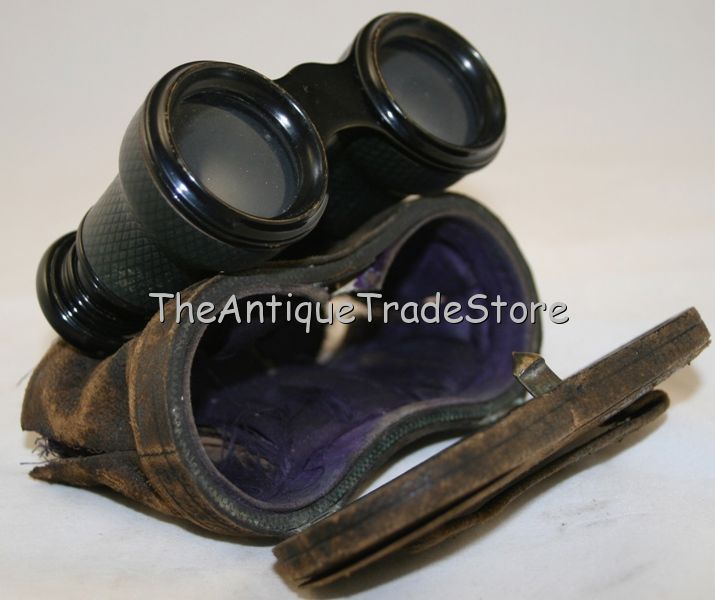 Antique small field binocular in the leather case