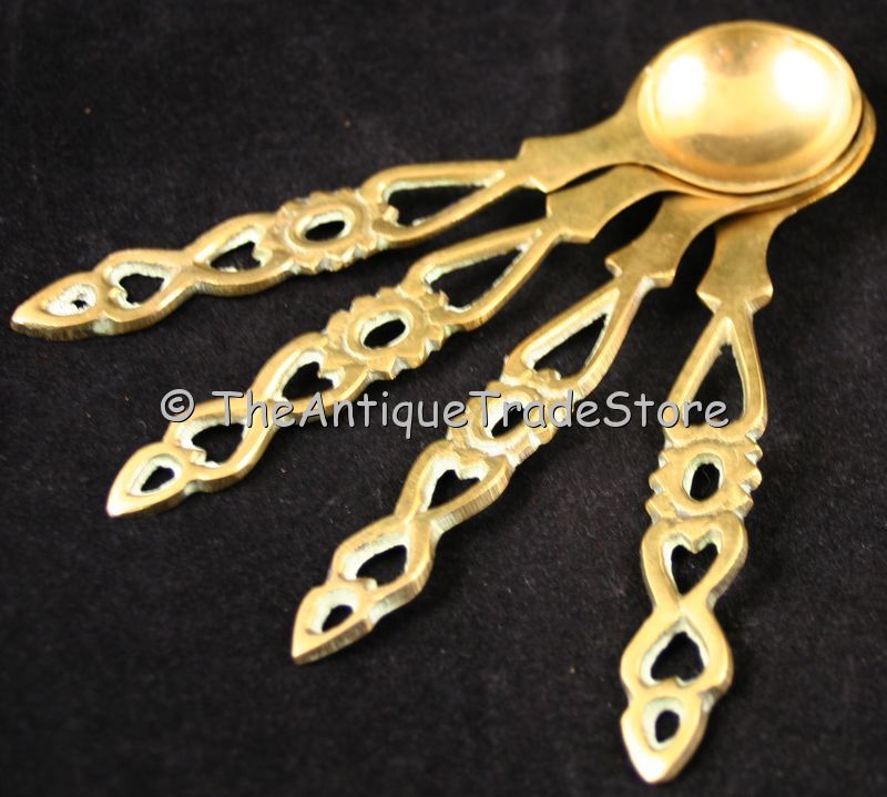 Vintage cast brass set of 4 spoons