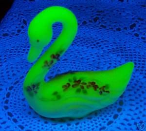 Fenton Burmese Glass Swan under Black Light