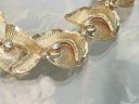 Roses and gold-tone bracelet