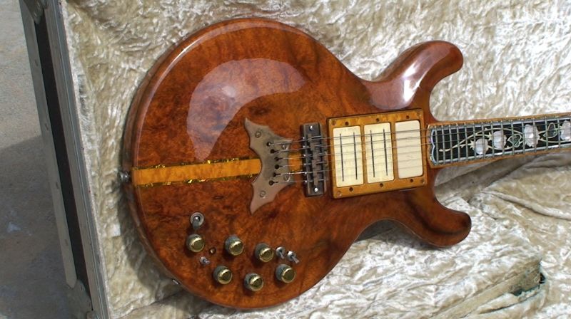 Allan Thomson guitar with Gibson & Fender strings on it